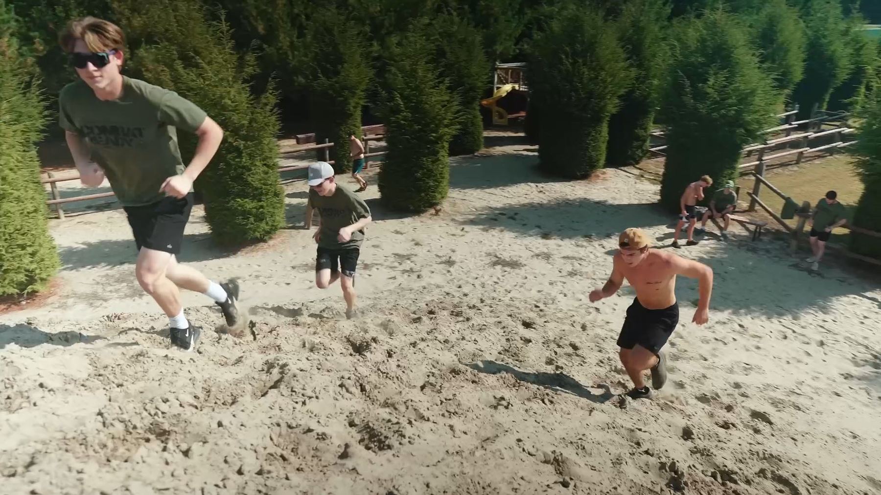 Guys sprinting up Sand Mountain at the FORGED men's retreat