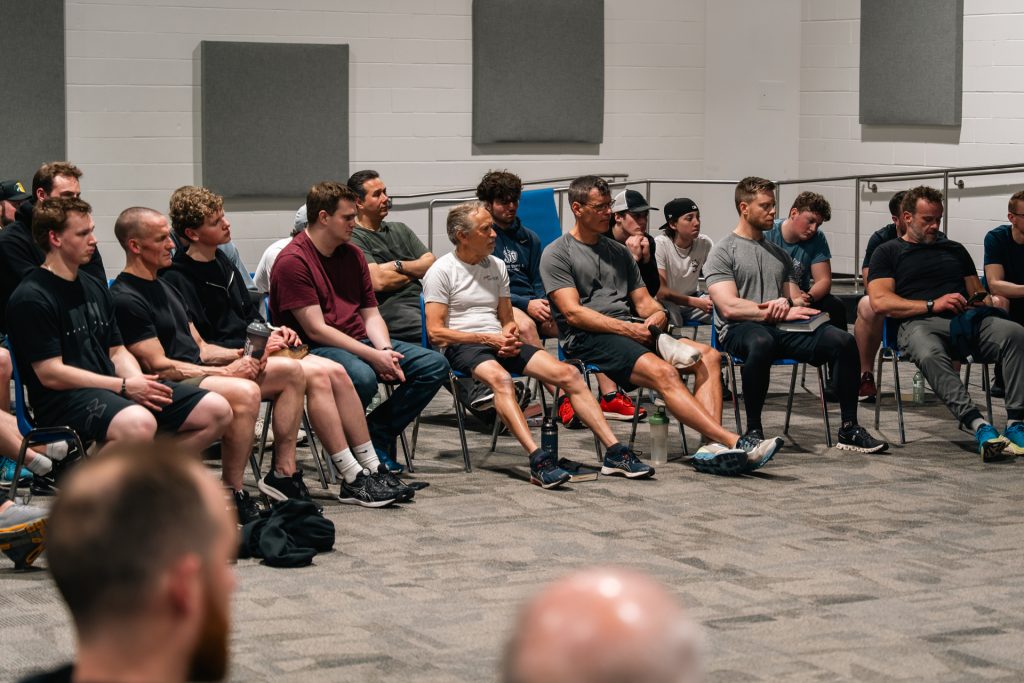 Men studying Scripture together at Forged 27:17