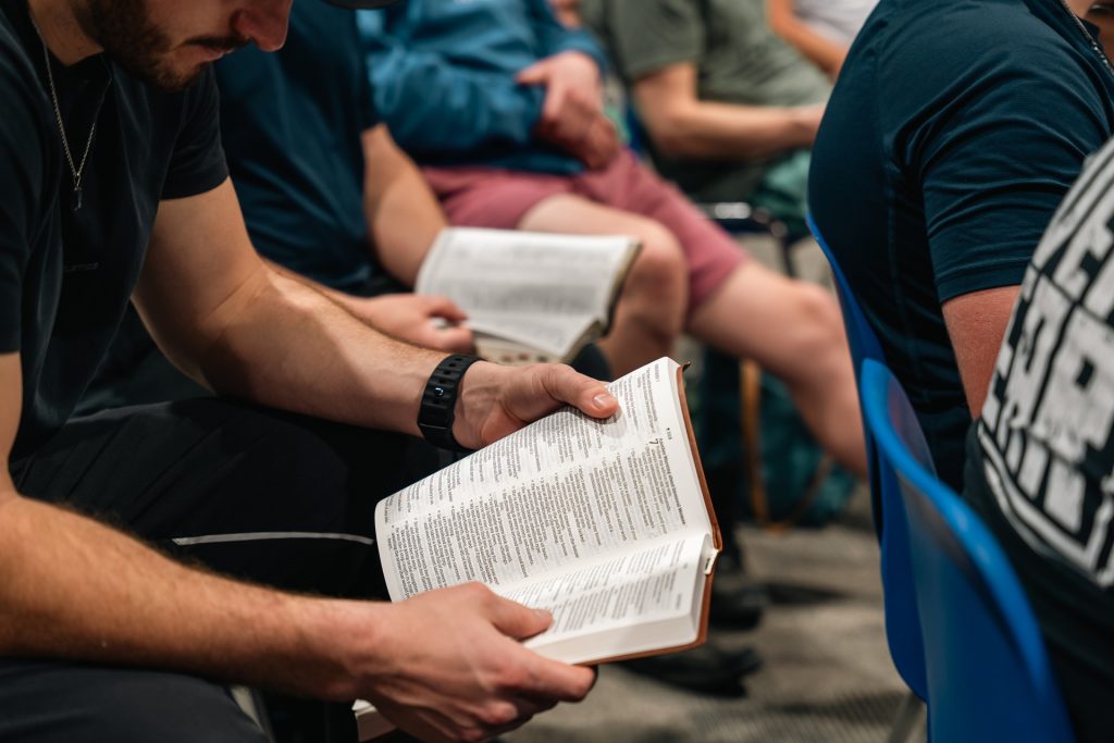 Men studying Scripture together at Forged 27:17