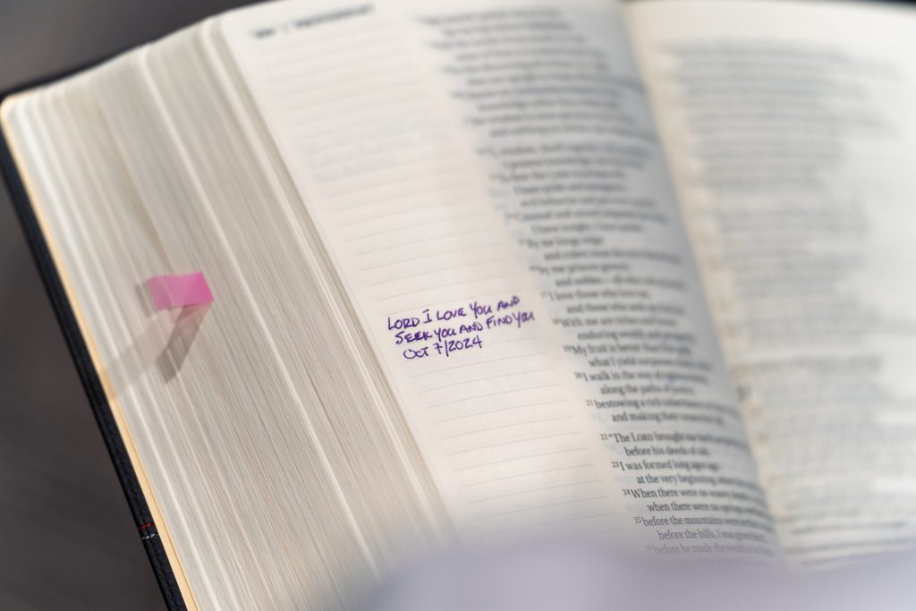 Men studying Scripture together at Forged 27:17