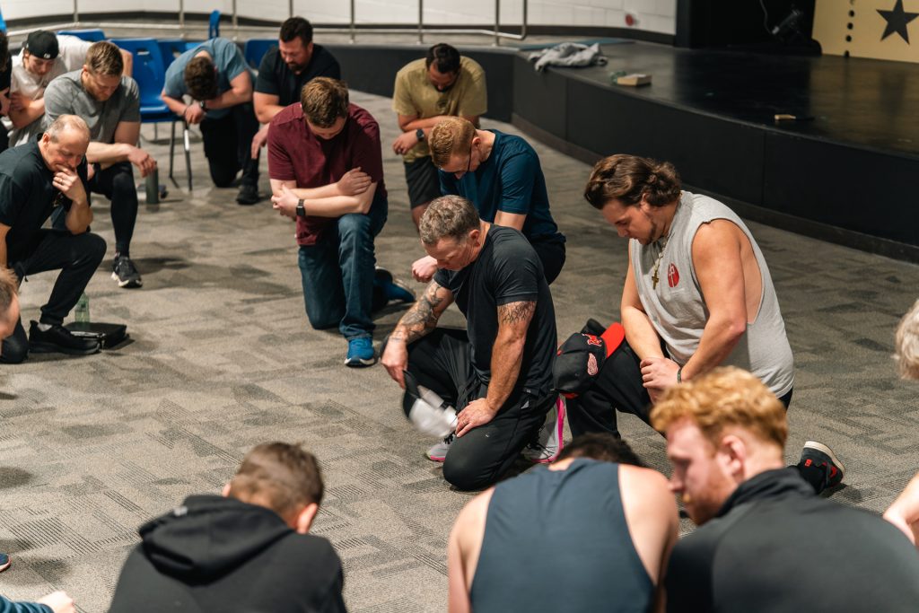 Men’s ministry prayer circle at Forged 27:17