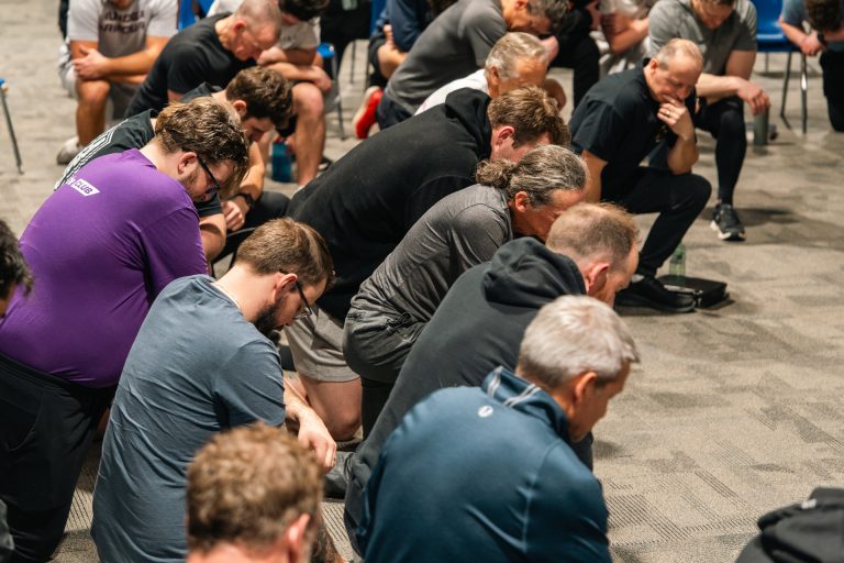 Men’s ministry prayer circle at Forged 27:17